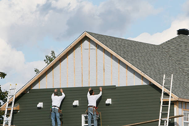 Professional Storm Damage Siding Repair technician working in Islandia, NY